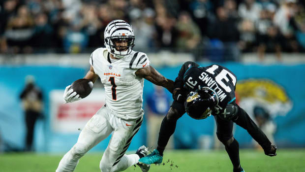 Dec 4, 2023; Jacksonville, Florida, USA; Cincinnati Bengals wide receiver Ja'Marr Chase (1) runs the ball against Jacksonville Jaguars cornerback Darious Williams (31) in extra time at EverBank Stadium. Mandatory Credit: Jeremy Reper-USA TODAY Sports  